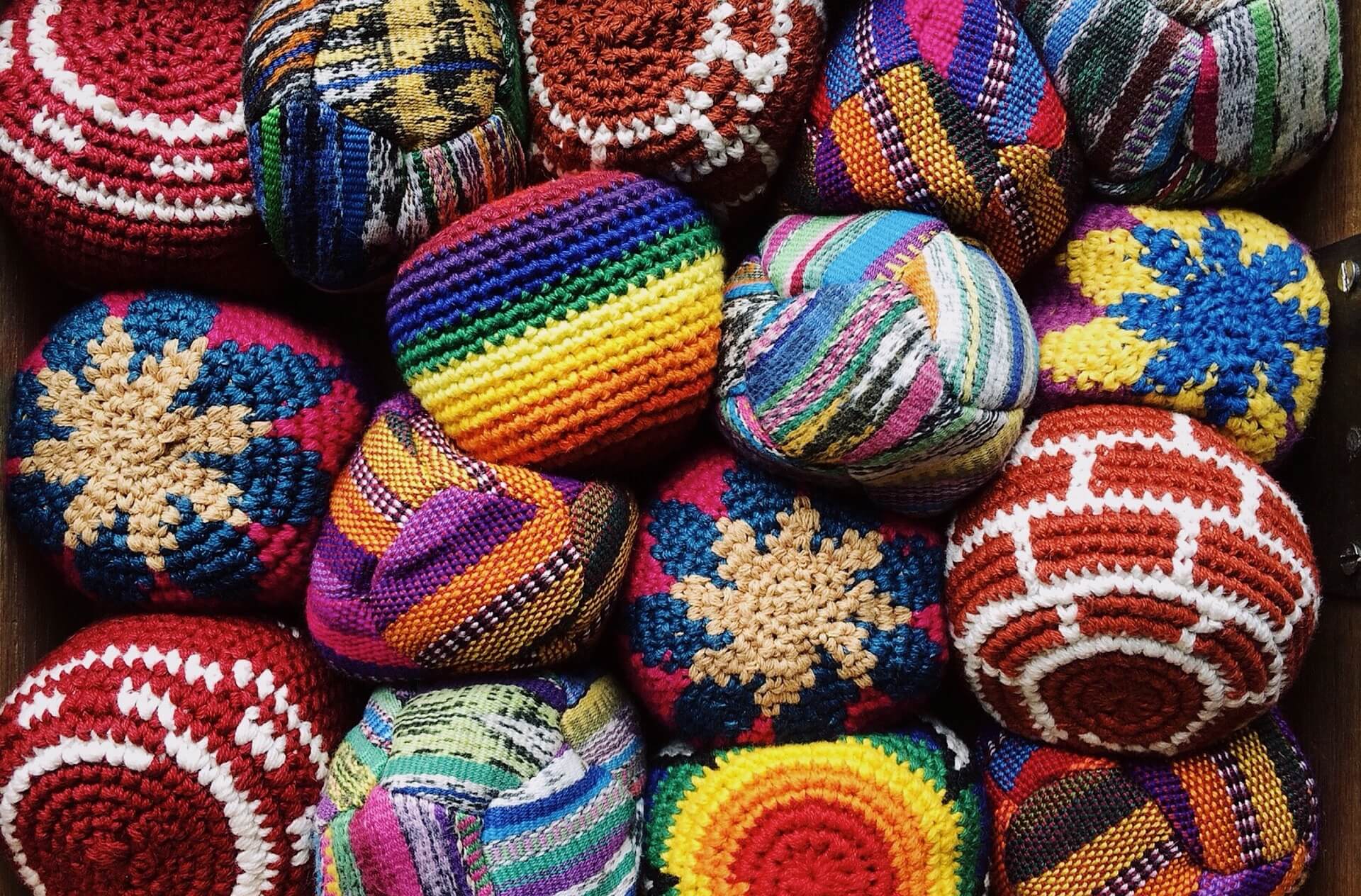 Colorful knitted holiday hackey sacks