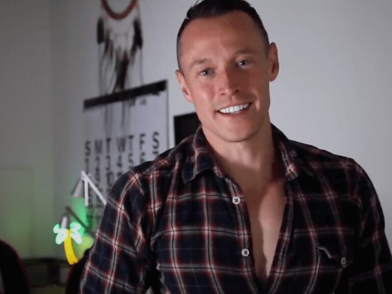 Davey Wavey in plaid speaking to the camera